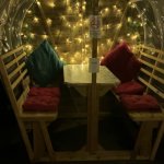 1 garden pod at night lit with pillows